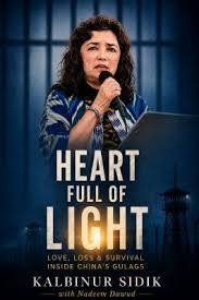 Cover of Heart Full of Light by Kalbinur Sidik with Nadeem Dawud: Kalbinur speaks into a microphone above the subtitle Love, Loss & Survival Inside China’s Gulags.